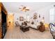Inviting living room with a ceiling fan, decorative furnishings, and seamless transition to other living spaces at 2289 Aloe Aly, Apopka, FL 32703