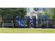 Community playground with a slide, climbing structure, and shade trees in a fenced area at 2289 Aloe Aly, Apopka, FL 32703