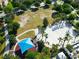 Aerial view of community park, beach volleyball court and a playground at 2412 Tanger Dr, Kissimmee, FL 34747