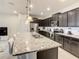 Spacious kitchen with a large island, stainless steel appliances, granite countertops, and plenty of storage at 2412 Tanger Dr, Kissimmee, FL 34747