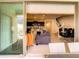 Open-concept living room leads to a modern kitchen and elegant dining area at 2412 Tanger Dr, Kissimmee, FL 34747