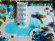 Aerial view of the luxurious community pool area featuring a splash area and lounge seating at 2412 Tanger Dr, Kissimmee, FL 34747