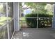 Screened patio with a view of the building and landscaping at 2593 Grassy Point Dr # 101, Lake Mary, FL 32746