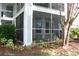 Screened patio showcasing an outdoor space, privacy, and a view of the surrounding landscaping at 2593 Grassy Point Dr # 101, Lake Mary, FL 32746