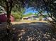Backyard with lawn, shade trees, a shed, and part of the home visible at 312 Verbena Dr, Orlando, FL 32807