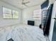 Bright bedroom with modern marble floors, natural light and ceiling fan at 312 Verbena Dr, Orlando, FL 32807