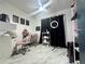 Bedroom with ring light, modern marble floor, and motivational wall decor at 312 Verbena Dr, Orlando, FL 32807