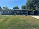 Charming single-story home with well-maintained lawn and covered carport at 312 Verbena Dr, Orlando, FL 32807