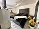 A spacious main bedroom with an upholstered headboard and stylish decorations at 312 Verbena Dr, Orlando, FL 32807