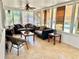 Bright sunroom with a ceiling fan and comfortable seating area at 312 Verbena Dr, Orlando, FL 32807