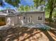 Backyard featuring lush greenery, a patio, and mature trees at 341 Kirkcaldy Dr, Winter Springs, FL 32708