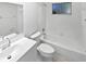 Clean, all-white bathroom with tub and shower combination and modern sink and vanity at 341 Kirkcaldy Dr, Winter Springs, FL 32708