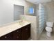 Neutral bathroom featuring a vanity with sink, and a shower with glass block at 341 Kirkcaldy Dr, Winter Springs, FL 32708