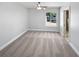 Bright bedroom with a ceiling fan, carpet, and large window overlooking the front yard at 341 Kirkcaldy Dr, Winter Springs, FL 32708