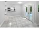 Bright breakfast nook featuring a bar to the kitchen and French doors leading to the backyard at 341 Kirkcaldy Dr, Winter Springs, FL 32708