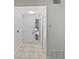 Bright entryway features a white front door, tile flooring, and a window letting in natural light at 341 Kirkcaldy Dr, Winter Springs, FL 32708