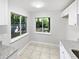 Bright kitchen featuring white cabinets and large windows overlooking the back yard at 341 Kirkcaldy Dr, Winter Springs, FL 32708