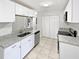 Well-lit kitchen with white cabinets, granite countertops, and stainless steel appliances at 341 Kirkcaldy Dr, Winter Springs, FL 32708