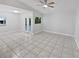 Spacious living room featuring ceramic floors, large windows and neutral paint at 341 Kirkcaldy Dr, Winter Springs, FL 32708