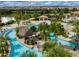 Aerial view of a community lazy river, showcasing the lush landscaping, recreational amenities, and Gathering-friendly atmosphere at 428 Ocean Course Ave, Davenport, FL 33896