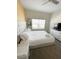 Bright bedroom featuring a comfortable bed, white dresser, and lots of natural light at 428 Ocean Course Ave, Davenport, FL 33896