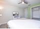 Inviting bedroom with TV, closet, and bright green accent wall at 428 Ocean Course Ave, Davenport, FL 33896