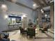 Inviting lobby area with comfortable seating, modern decor, and stylish lighting fixtures at 428 Ocean Course Ave, Davenport, FL 33896