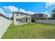 Expansive backyard featuring a lush green lawn and a privacy fence, ideal for Gathering enjoyment and outdoor activities at 5144 Ravena E Ave, St Cloud, FL 34771