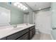 The bathroom features a double vanity and a shower-tub combo at 5144 Ravena E Ave, St Cloud, FL 34771