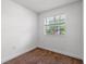 Cozy bedroom with neutral carpeting, a window with a view, and light walls at 5144 Ravena E Ave, St Cloud, FL 34771