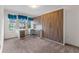 Bright bedroom with built-in desk, cabinets, and three windows providing natural light at 5144 Ravena E Ave, St Cloud, FL 34771