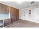 Bedroom featuring built-in cabinets and desk space, complete with neutral carpeting at 5144 Ravena E Ave, St Cloud, FL 34771