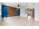Spacious living room with an accent wall, tile flooring, and natural light at 5144 Ravena E Ave, St Cloud, FL 34771
