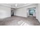 Spacious main bedroom with neutral carpet and an ensuite bath and walk-in closet at 5144 Ravena E Ave, St Cloud, FL 34771