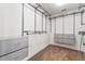 This walk-in closet has a neutral carpet and a built-in shelving system at 5144 Ravena E Ave, St Cloud, FL 34771