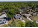 Bird's eye view of a charming home featuring a well-manicured lawn and solar panels at 515 Columbus Ave, Orange City, FL 32763