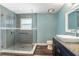 Updated bathroom with glass shower enclosure, modern vanity, and neutral color palette at 515 Columbus Ave, Orange City, FL 32763