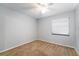 Bedroom with neutral walls, neutral carpet, and a double hung window at 515 Columbus Ave, Orange City, FL 32763