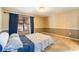 Bedroom with neutral walls, neutral carpet, double-hung window, and white trim at 515 Columbus Ave, Orange City, FL 32763