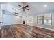 Large living room with wood floors, fireplace, French doors and vaulted ceilings at 515 Columbus Ave, Orange City, FL 32763