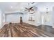 Open living room featuring wood floors, vaulted ceilings, and a bright and airy atmosphere at 515 Columbus Ave, Orange City, FL 32763