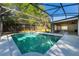 Screened-in pool and patio area with mature trees at 515 Columbus Ave, Orange City, FL 32763