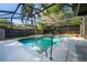 Screened-in pool and patio area features a spa at 515 Columbus Ave, Orange City, FL 32763