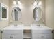 Elegant bathroom featuring double vanity sinks, framed mirrors, and ample counter space at 519 N Clara Ave, Deland, FL 32720
