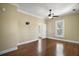 Spacious bedroom includes a ceiling fan, hardwood floors, and a bright window at 519 N Clara Ave, Deland, FL 32720