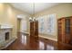 Elegant dining room with a brick fireplace and wood built-ins at 519 N Clara Ave, Deland, FL 32720