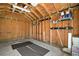 Unfinished garage interior, perfect for storage or conversion, showing exposed framing and shelving at 519 N Clara Ave, Deland, FL 32720