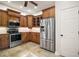 Updated kitchen featuring stainless steel appliances and wooden cabinetry at 519 N Clara Ave, Deland, FL 32720