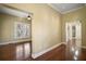 Open living room featuring gleaming wood floors and natural light at 519 N Clara Ave, Deland, FL 32720
