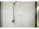 Clean and simple tiled shower with a chrome shower head and handle at 519 N Clara Ave, Deland, FL 32720